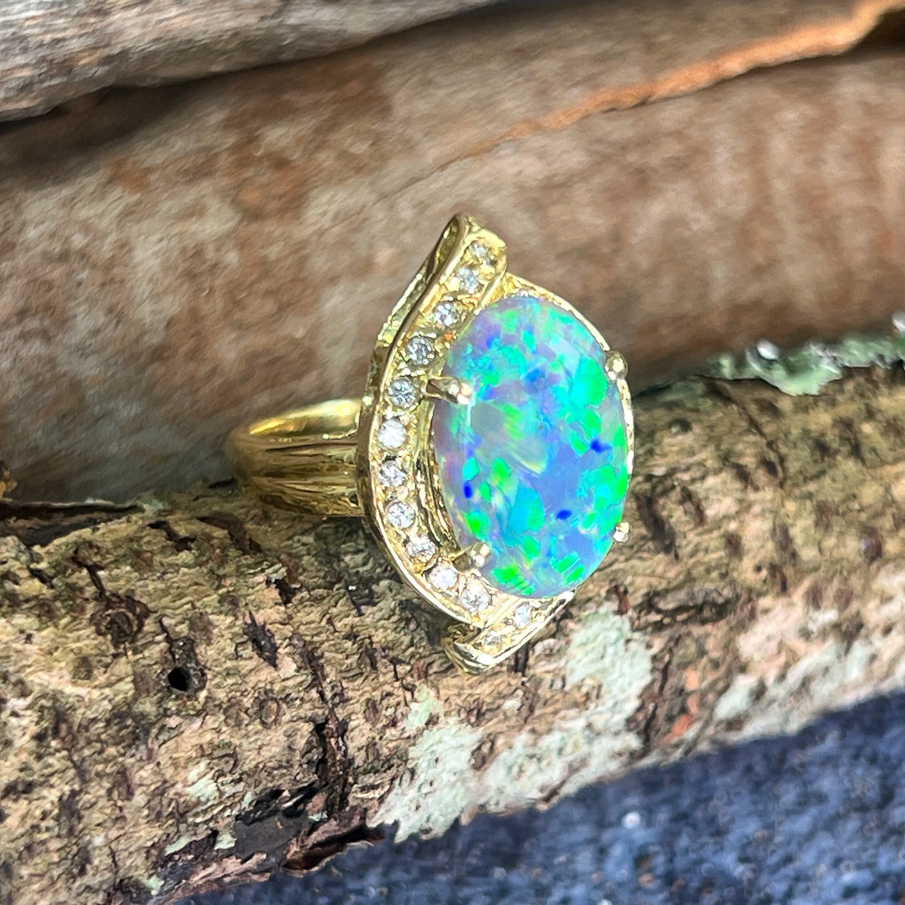 18kt Yellow Gold Black Opal 4ct Green Blue and diamond ring