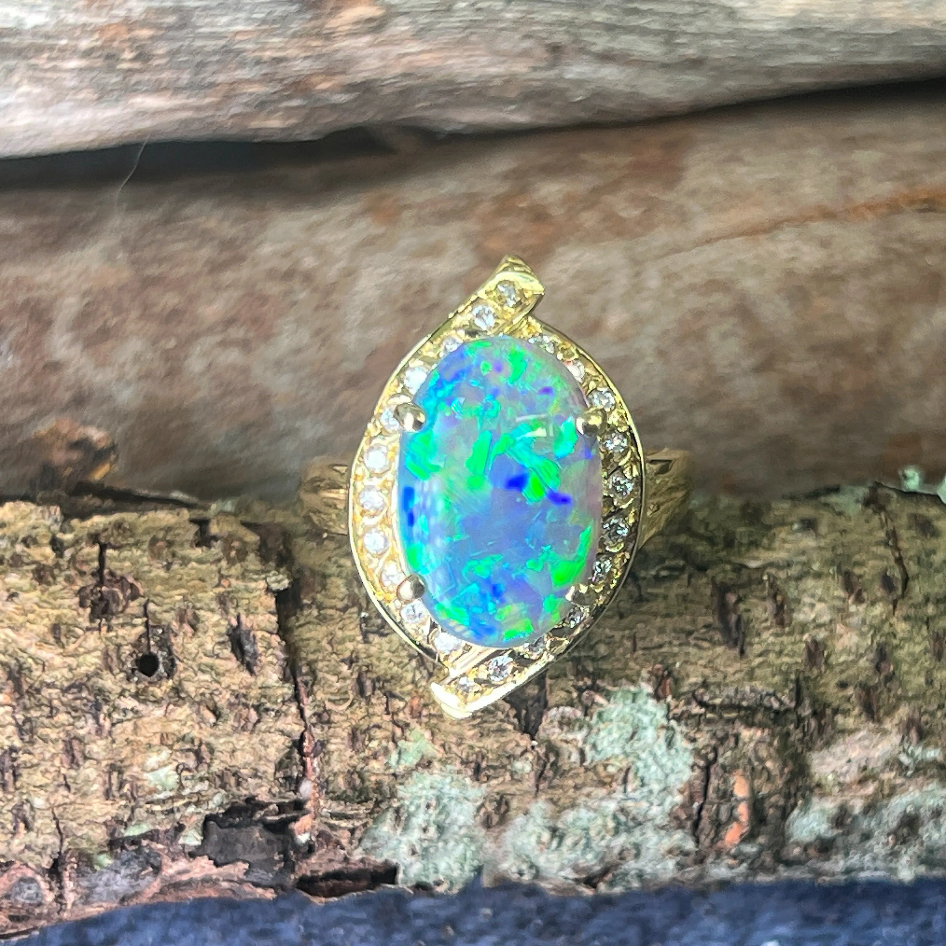 18kt Yellow Gold Black Opal 4ct Green Blue and diamond ring