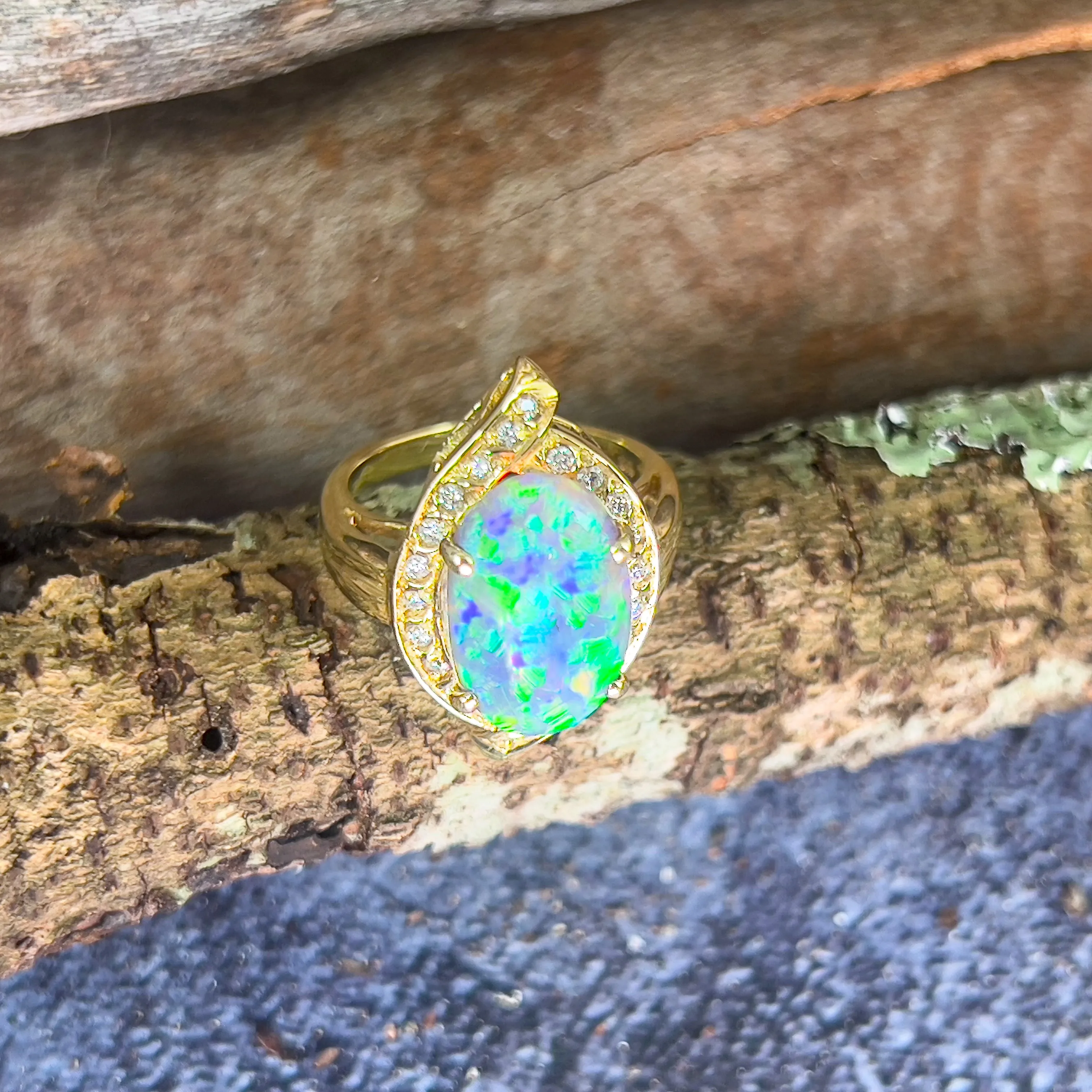 18kt Yellow Gold Black Opal 4ct Green Blue and diamond ring