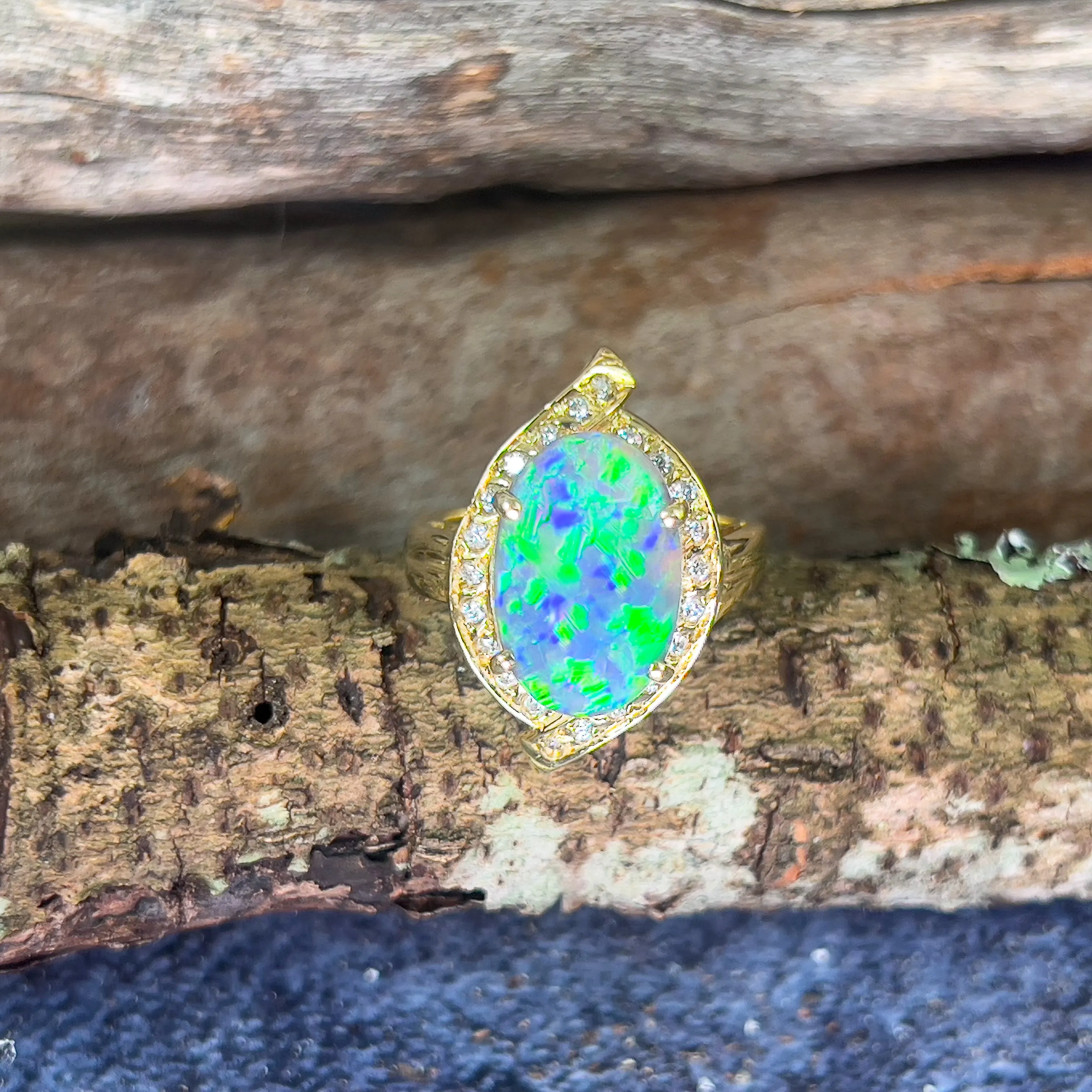 18kt Yellow Gold Black Opal 4ct Green Blue and diamond ring