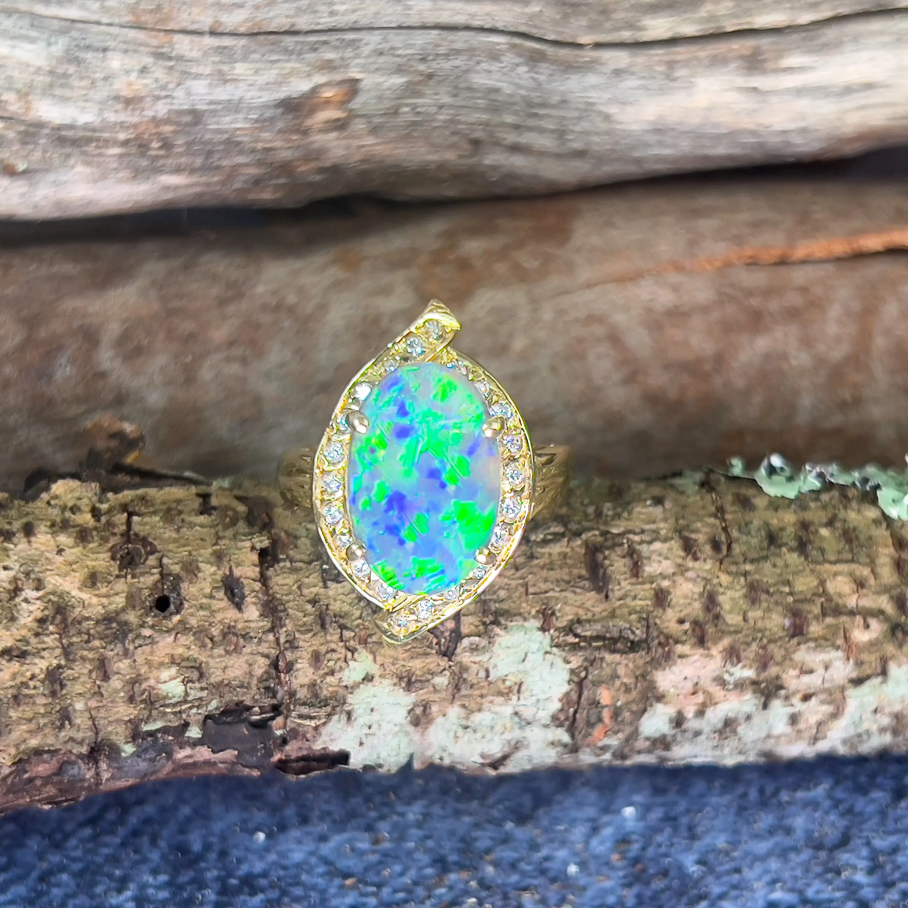 18kt Yellow Gold Black Opal 4ct Green Blue and diamond ring